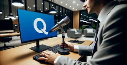Person with mic using Dictation-in-Outlook faces monitor with a 'Q' icon suggesting voice commands.
